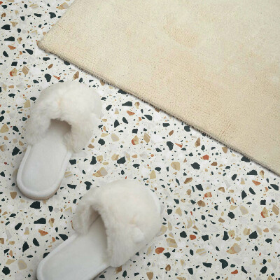 Self adhesive vinyl floor tiles Stone motif in the background