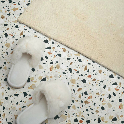Self adhesive vinyl floor tiles Stone motif in the background