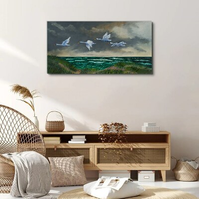 Flight of swans over the sea Canvas wall art