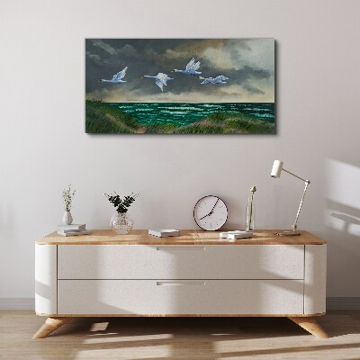 Flight of swans over the sea Canvas wall art
