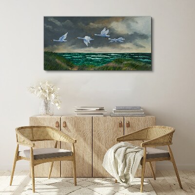Flight of swans over the sea Canvas wall art