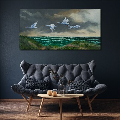 Flight of swans over the sea Canvas wall art