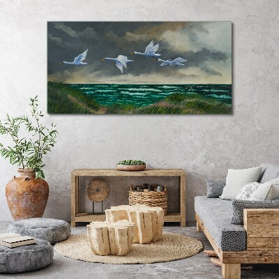 Flight of swans over the sea Canvas wall art