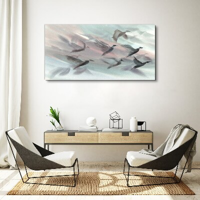 Flight of birds in a pastel aura Canvas wall art