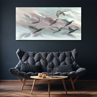 Flight of birds in a pastel aura Canvas wall art