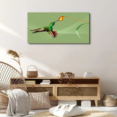 Hummingbird at a flower Print on canvas