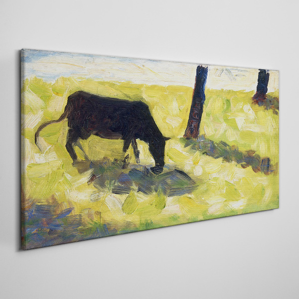 A cow grazing in a green landscape Print on canvas