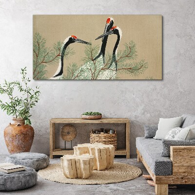 Three cranes among the pine branches Print on canvas