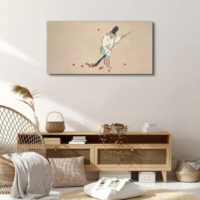 Monk cleaning with leaves Canvas wall art