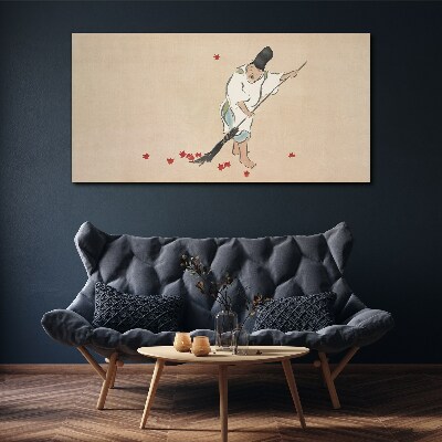 Monk cleaning with leaves Canvas wall art