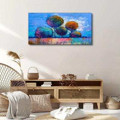 Colorful trees on a blue background Print on canvas