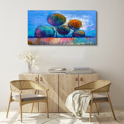 Colorful trees on a blue background Print on canvas
