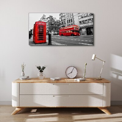 Red telephone in a grey city Canvas wall art