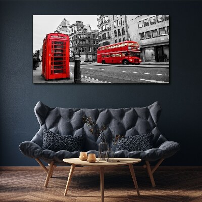 Red telephone in a grey city Canvas wall art