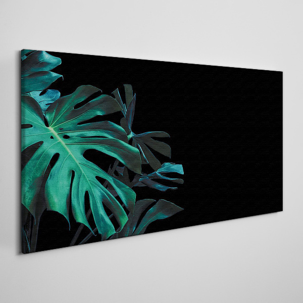 Green leaves on a black background Print on canvas