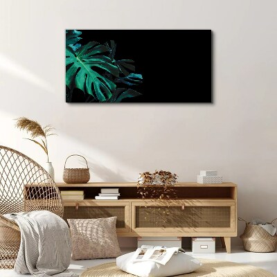 Green leaves on a black background Print on canvas
