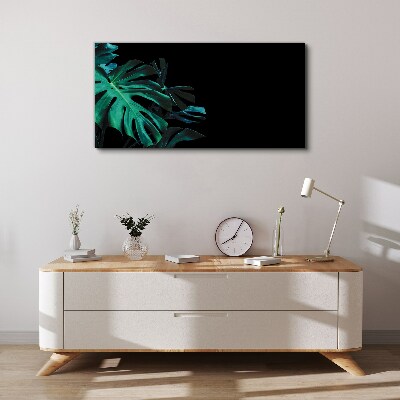 Green leaves on a black background Print on canvas