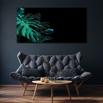 Green leaves on a black background Print on canvas