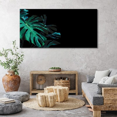 Green leaves on a black background Print on canvas
