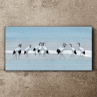 Flocks of cranes on a blue background Print on canvas