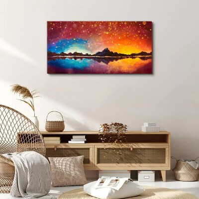 Sunset over a mountain lake Canvas wall art