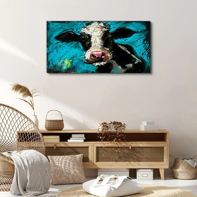 Portrait of a cow on a blue background Print on canvas