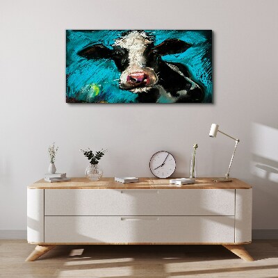 Portrait of a cow on a blue background Print on canvas