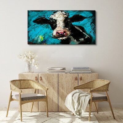 Portrait of a cow on a blue background Print on canvas