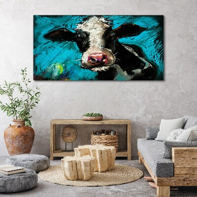 Portrait of a cow on a blue background Print on canvas