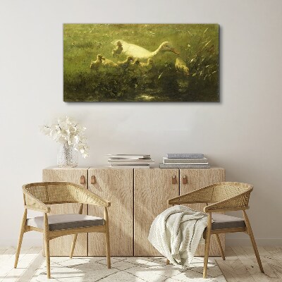 Duck with chicks in the grass Print on canvas