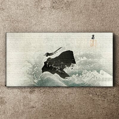 A bird on a rock in the waves Canvas wall art