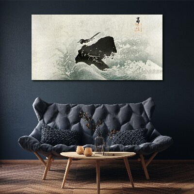 A bird on a rock in the waves Canvas wall art