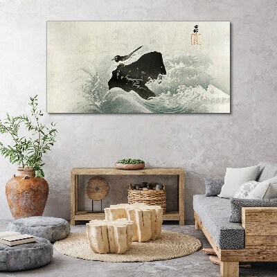 A bird on a rock in the waves Canvas wall art