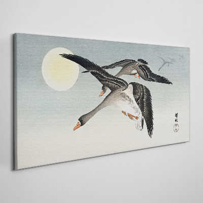 Geese in flight under the full moon Canvas wall art