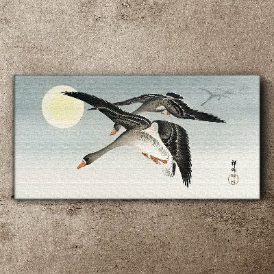 Geese in flight under the full moon Canvas wall art