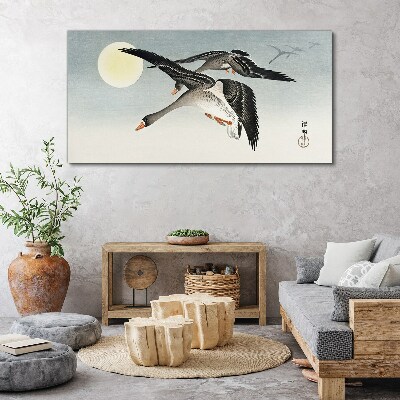 Geese in flight under the full moon Canvas wall art