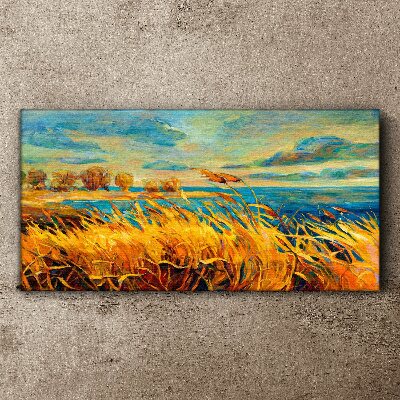Golden grass over blue water Canvas wall art