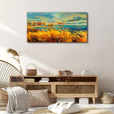 Golden grass over blue water Canvas wall art
