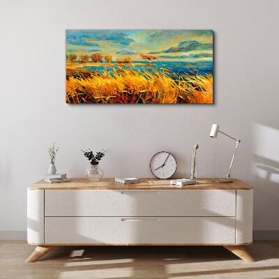 Golden grass over blue water Canvas wall art