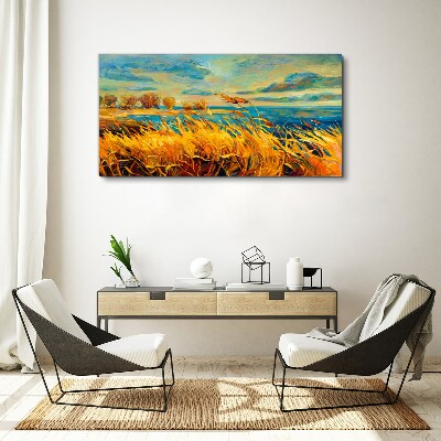 Golden grass over blue water Canvas wall art