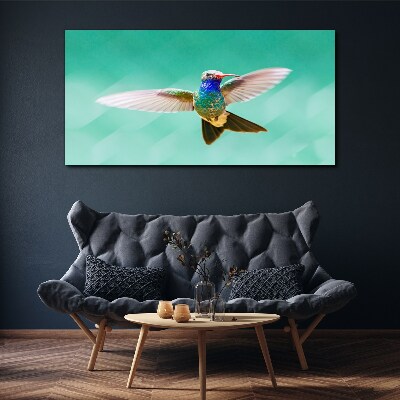 Hummingbird in blue background Canvas wall art