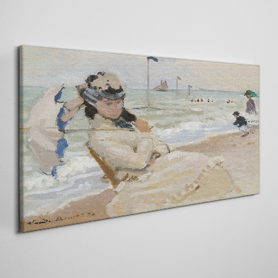 Woman on the beach with an umbrella Canvas wall art
