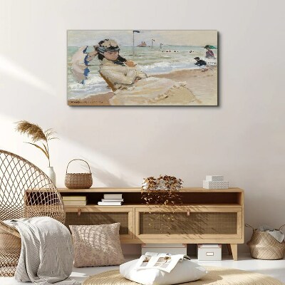 Woman on the beach with an umbrella Canvas wall art