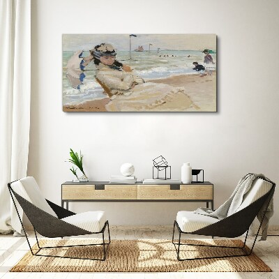 Woman on the beach with an umbrella Canvas wall art