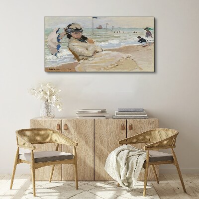 Woman on the beach with an umbrella Canvas wall art