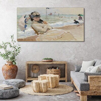 Woman on the beach with an umbrella Canvas wall art