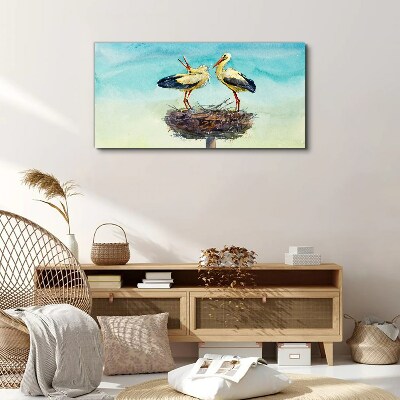 Storks on a nest in the blue Print on canvas