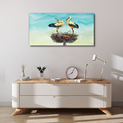 Storks on a nest in the blue Print on canvas