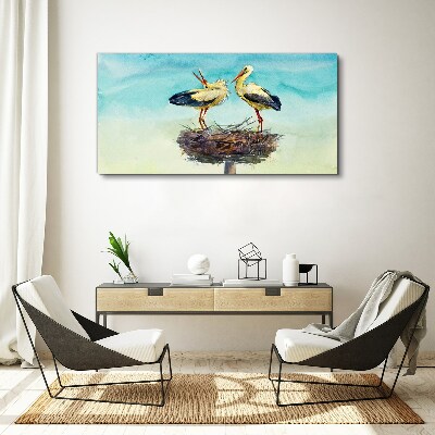 Storks on a nest in the blue Print on canvas