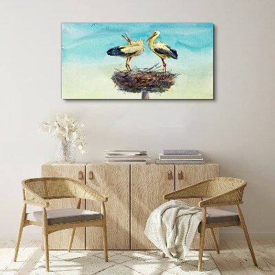 Storks on a nest in the blue Print on canvas